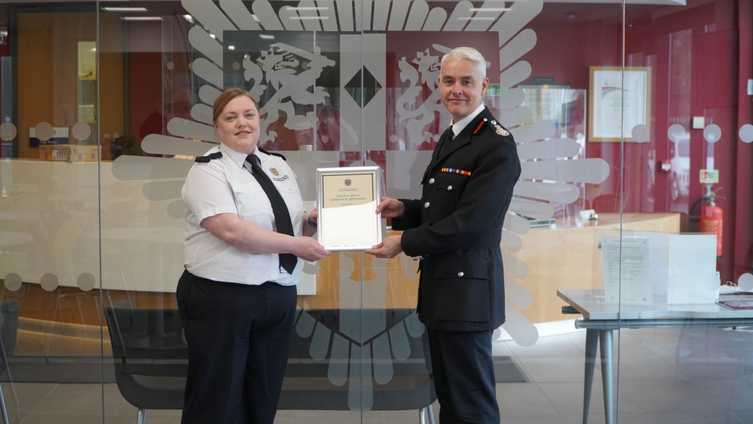 Gemma Woodhouse receiving certificate of appreciation for CFO Errington