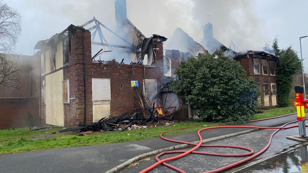 photo of the willington leisure centre burnt out with smoke coming from the roof