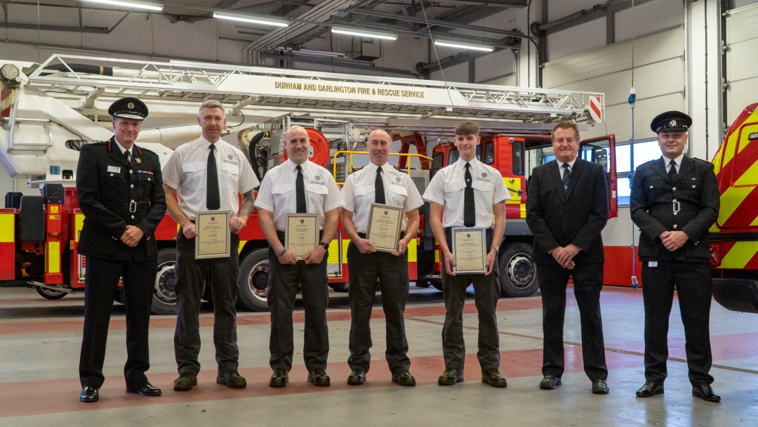 Picture shows left to right: CFO Steve Helps, FF Neil Swinback, FF Ian Harris, Watch Manager Graeme Hall, FF Jack Helps, Chair of the Fire Authority John Shuttleworth and Group Manager Justin Parry 