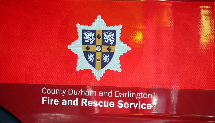side of a fire appliance with the service crest and logo