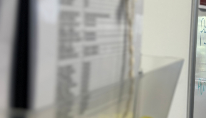 an semi blurred picture of a paper and clipboard on a wall 