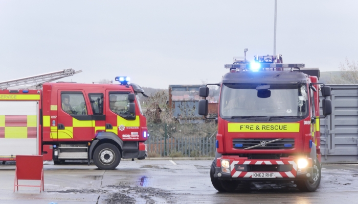 A picture of two fire engines on a road at the service's training centre