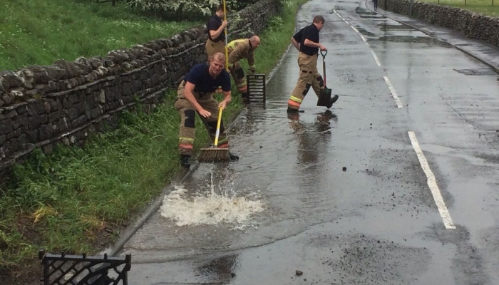 Picture shows firefighters dealing with a flash flood in Stanhope