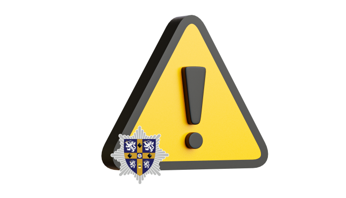 An illustration of a warning sign featuring an exclamation mark and the service crest