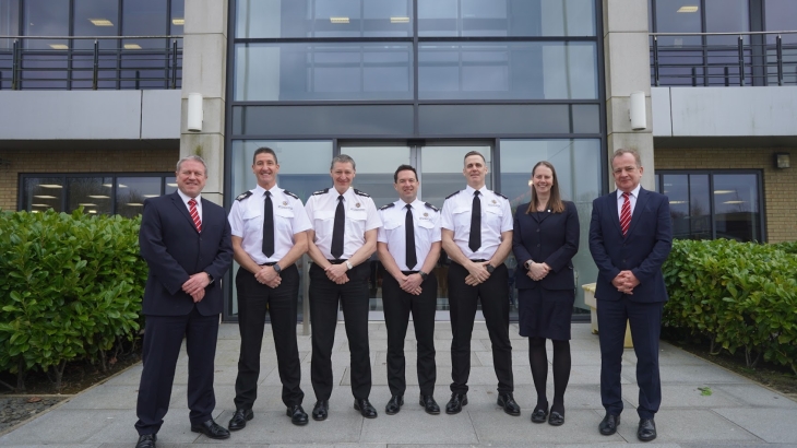 The Senior Leadership Team standing outside of HQ.