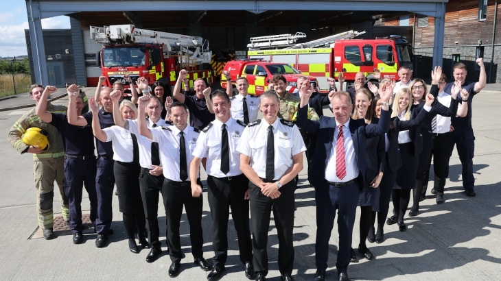 Service staff celebrating alongside Chief Fire Officer Steve Helps. 
