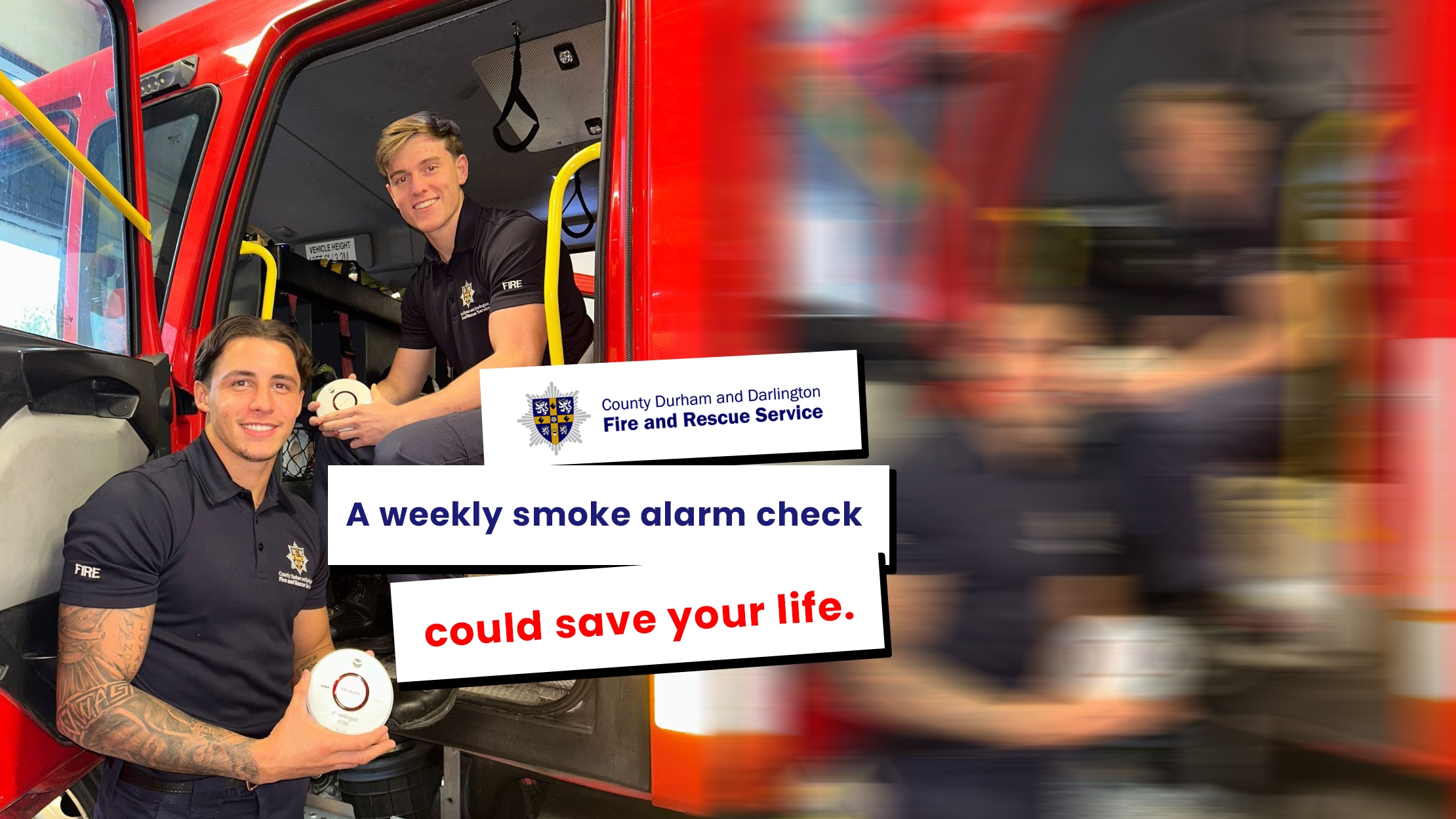 Two male firefighters holding smoke alarms and wearing blue uniform while standing and sitting by door or fire engine. Text reads:' A weekly smoke alarm check could save your life.' 