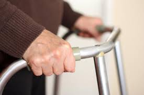 elderly hands on a metal walking aid