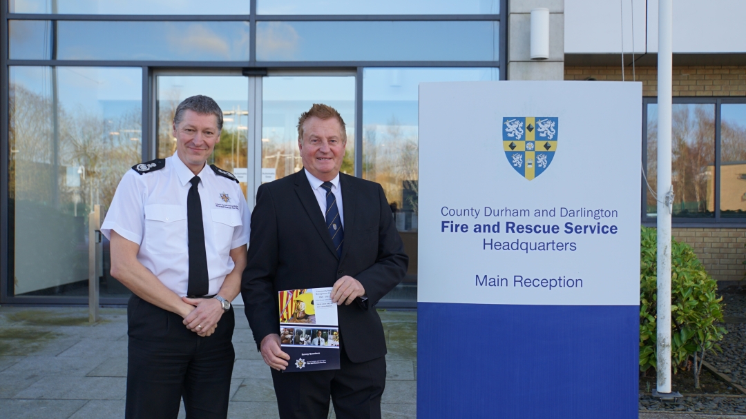 CFO Steve Helps stands next to CLLR Shuttleworth holding CRMP booklet