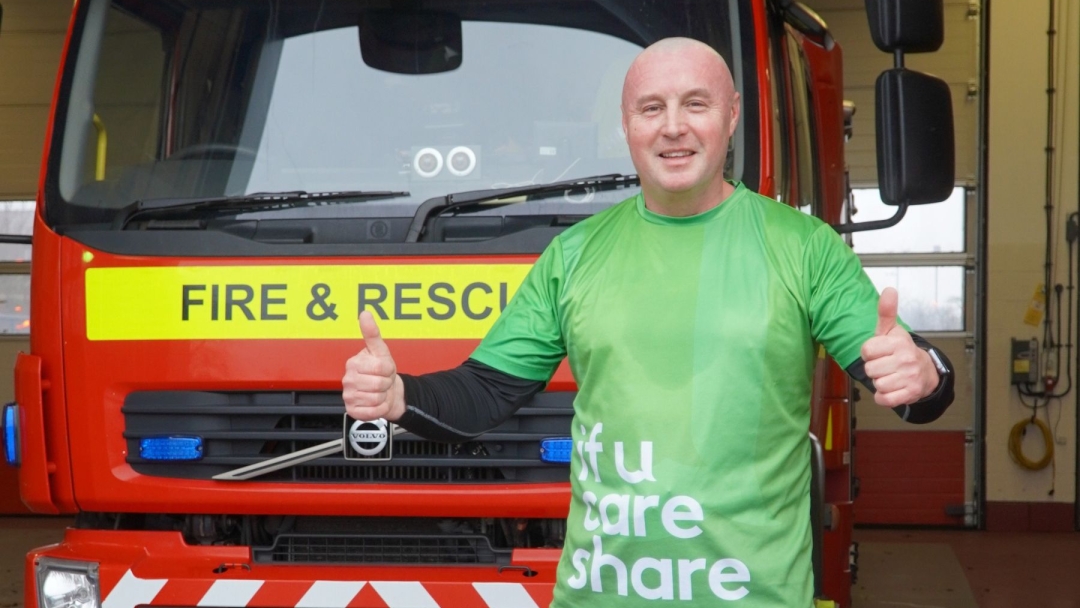 Durham Crew Manager Paul Bainbridge standing in front of a fire engine. 