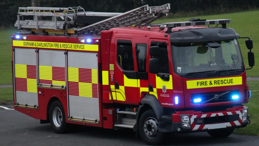 Fire engine with lights on.