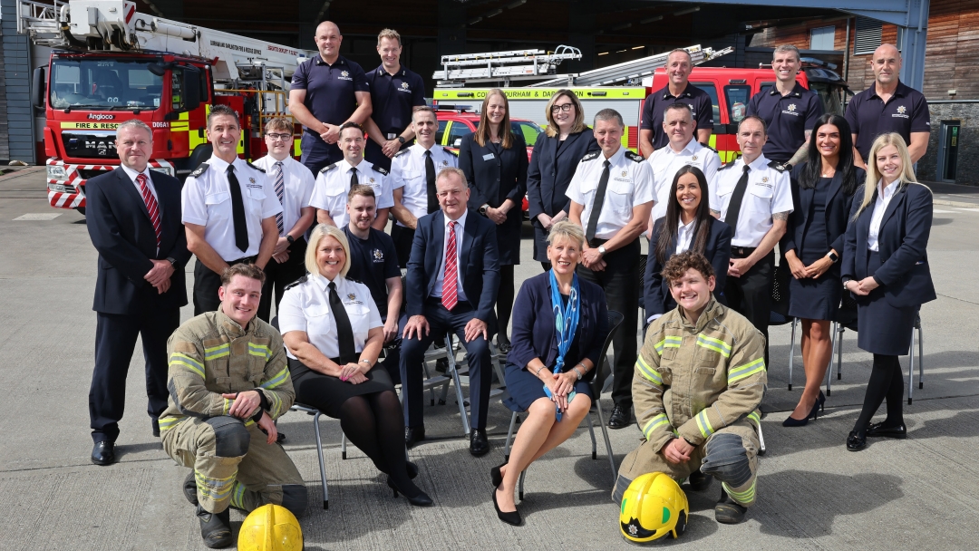 Chief Fire Officer Steve Helps and Deputy Chief Fire Officer Keith Carruthers surrounded by HQ and operational staff. 