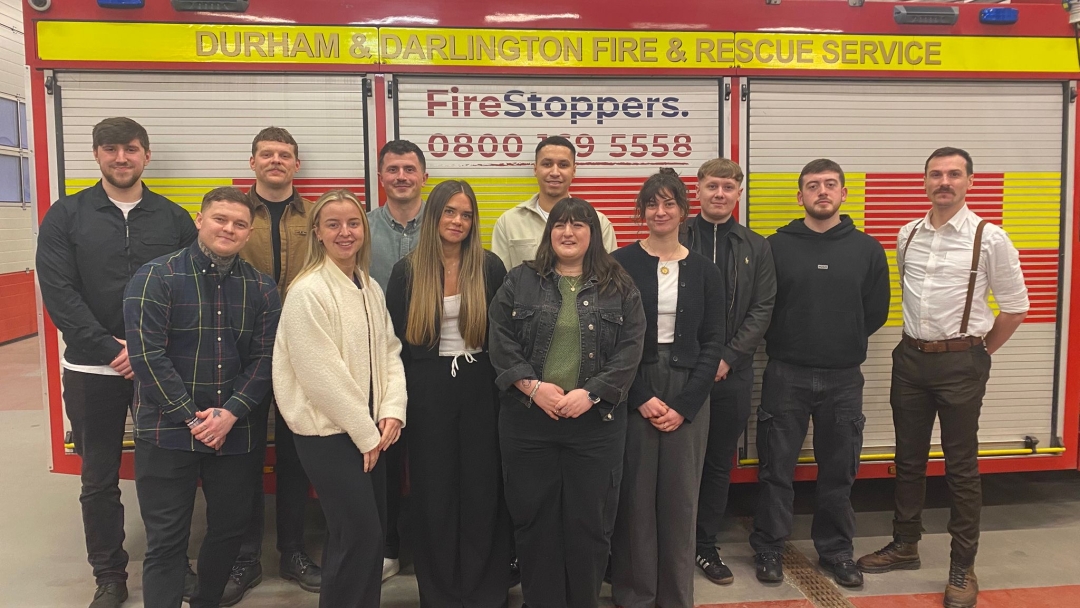 Students who completed the first Fire Futures course standing in front of a fire engine. 