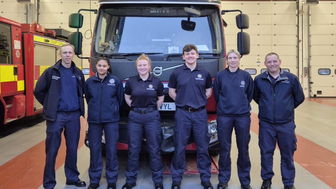 Six firefighters in Darlington standing in front of a fire engine. 
